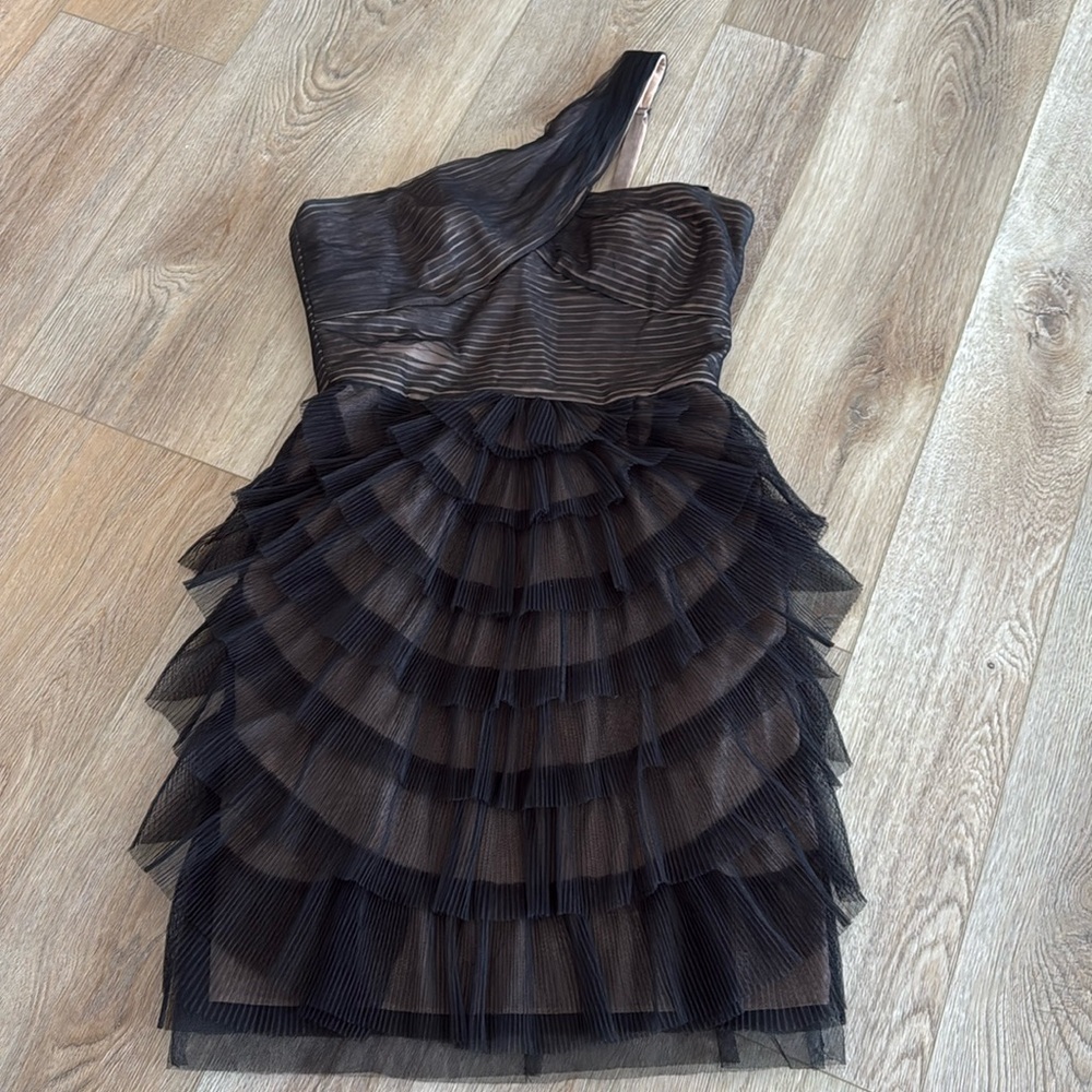 Black tool mini dress over nude underlay